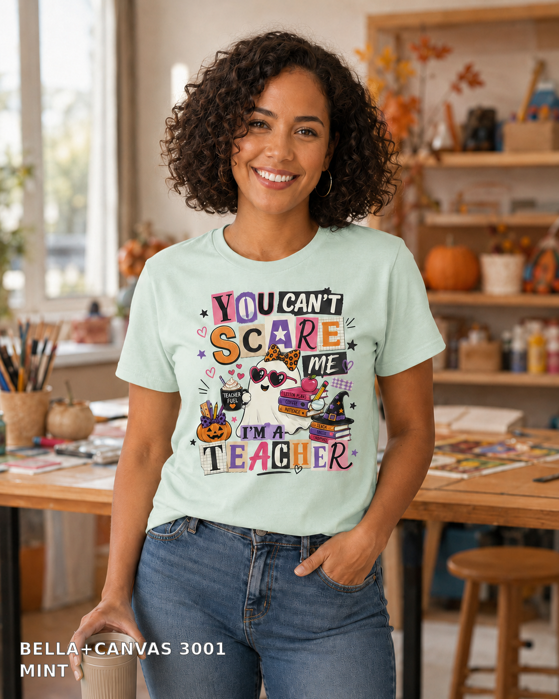 Female model wearing You Can't Scare Me I'm a Teacher Halloween T-shirt - Bella+Canvas 3001 - Mint