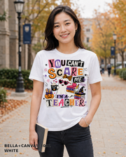 Female model wearing You Can't Scare Me I'm a Teacher Halloween T-shirt - Bella+Canvas 3001 - White