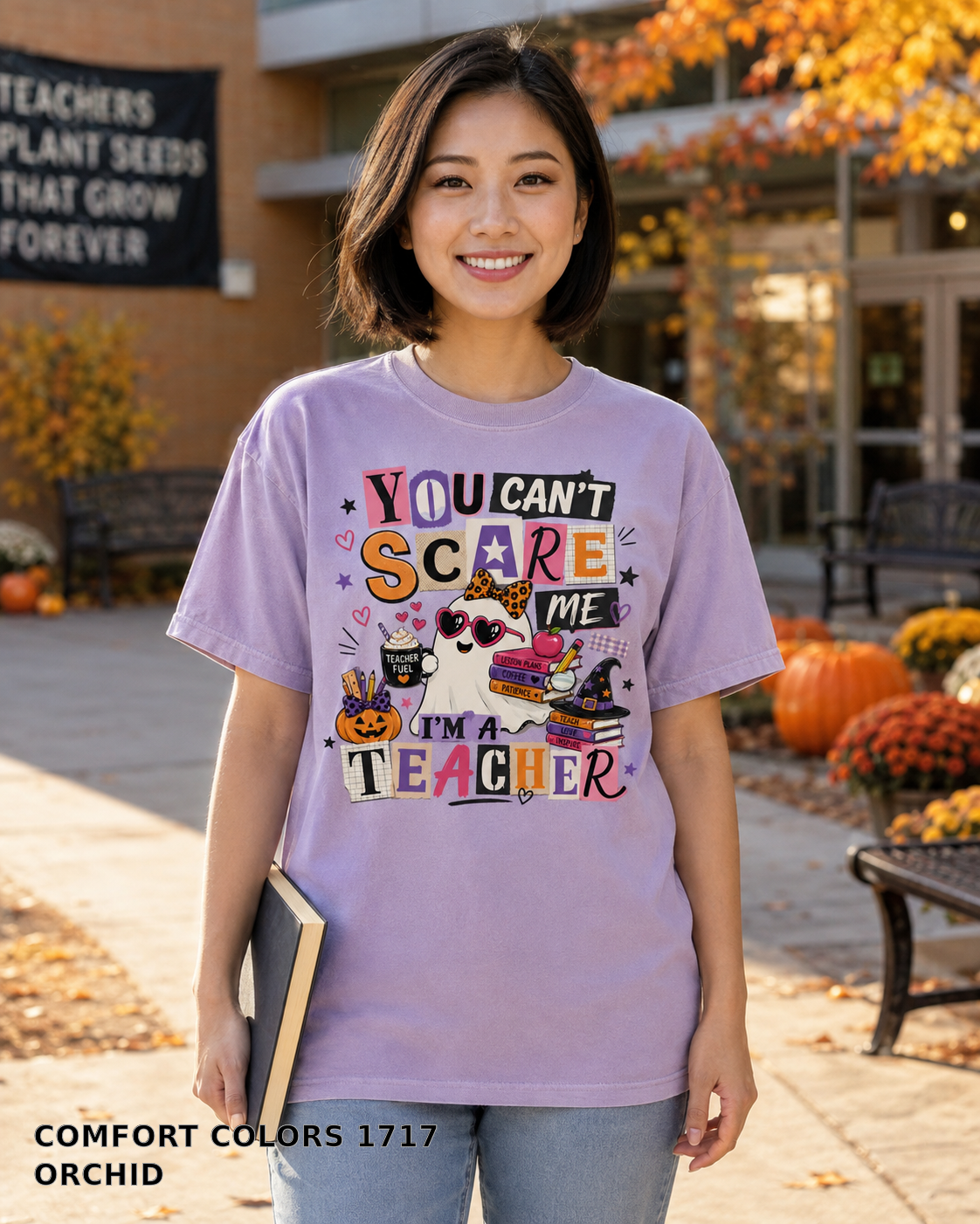 Female model wearing You Can't Scare Me I'm a Teacher Halloween T-shirt - Comfort Colors 1717 - Orchid