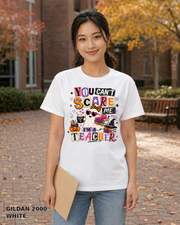 Female model wearing You Can't Scare Me I'm a Teacher Halloween T-shirt - Gildan 2000 - White