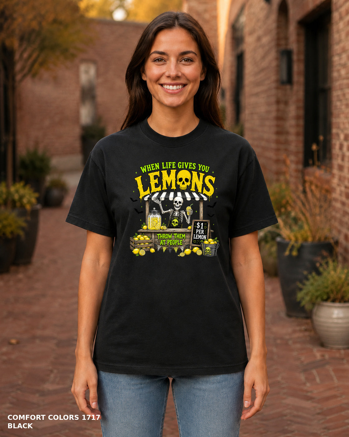Female model wearing Comfort Colors 1717 Black When Life Gives You Lemons skeleton Halloween T-shirt, corrected artwork