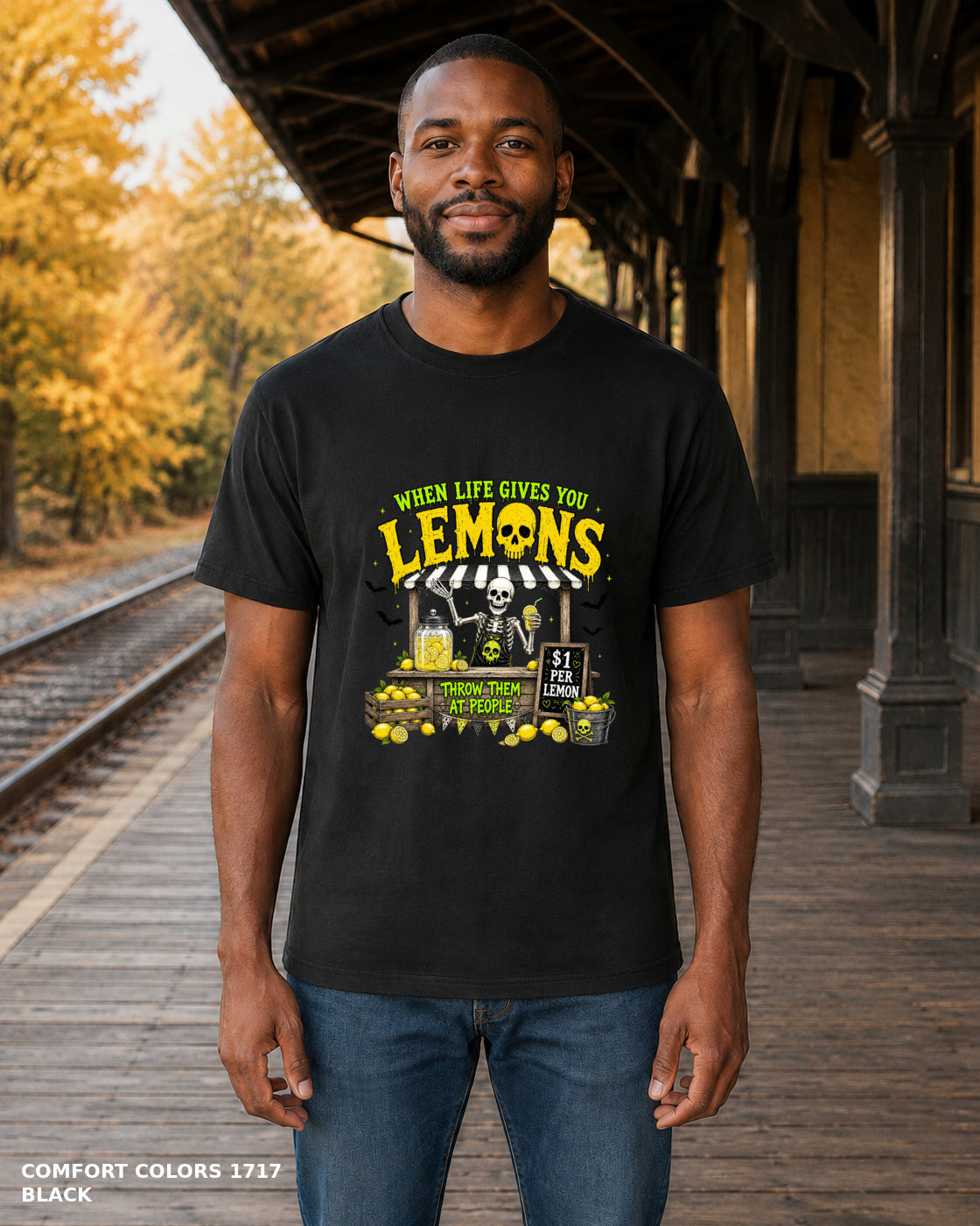 Male model wearing Comfort Colors 1717 Black When Life Gives You Lemons skeleton Halloween T-shirt, corrected artwork