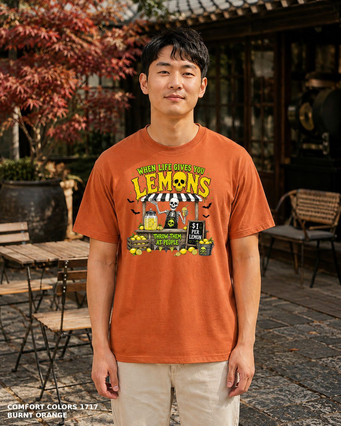 Male model wearing Comfort Colors 1717 Burnt Orange When Life Gives You Lemons skeleton Halloween T-shirt, corrected artwork