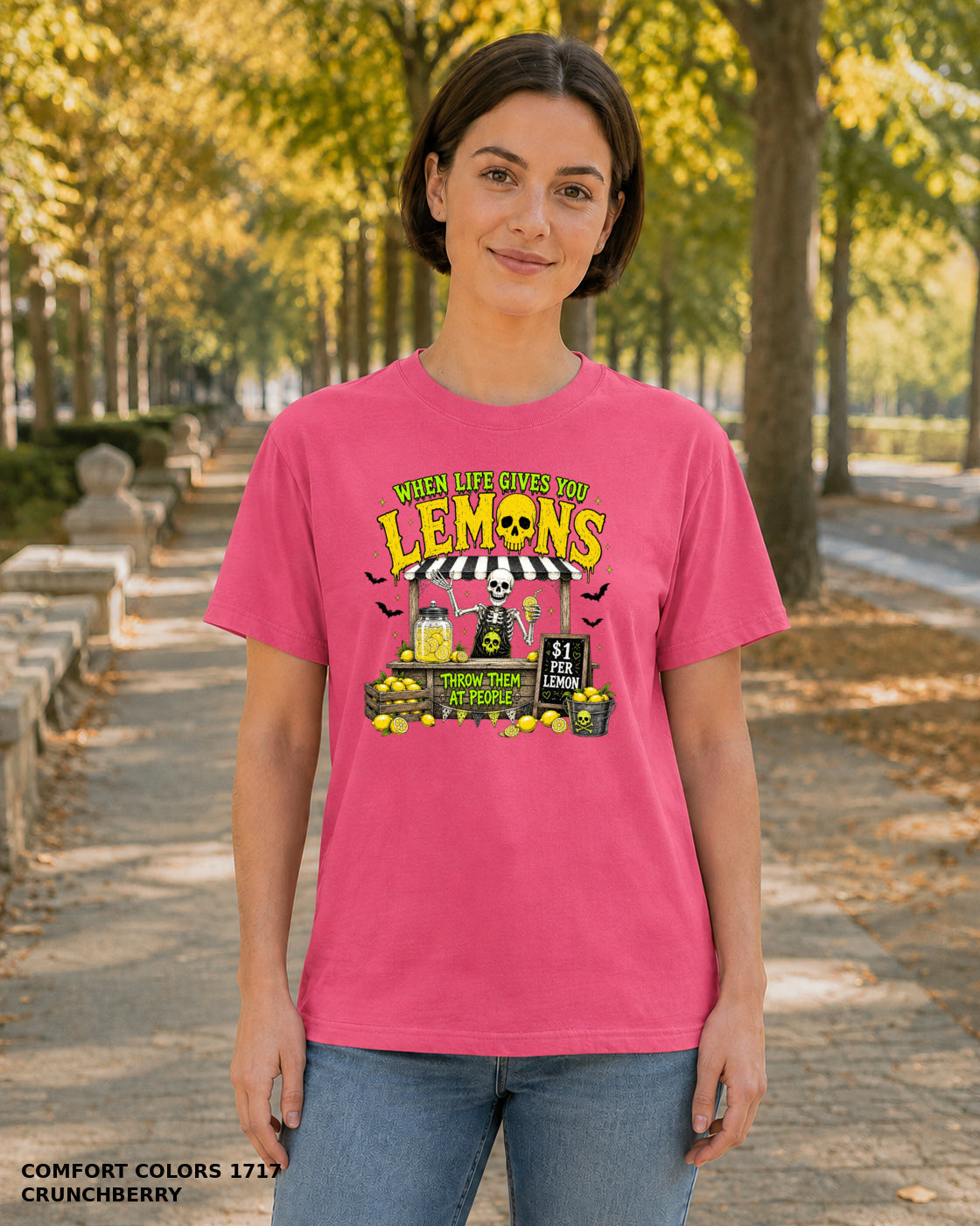 Female model wearing Comfort Colors 1717 Crunchberry When Life Gives You Lemons skeleton Halloween T-shirt, artwork positioned slightly lower