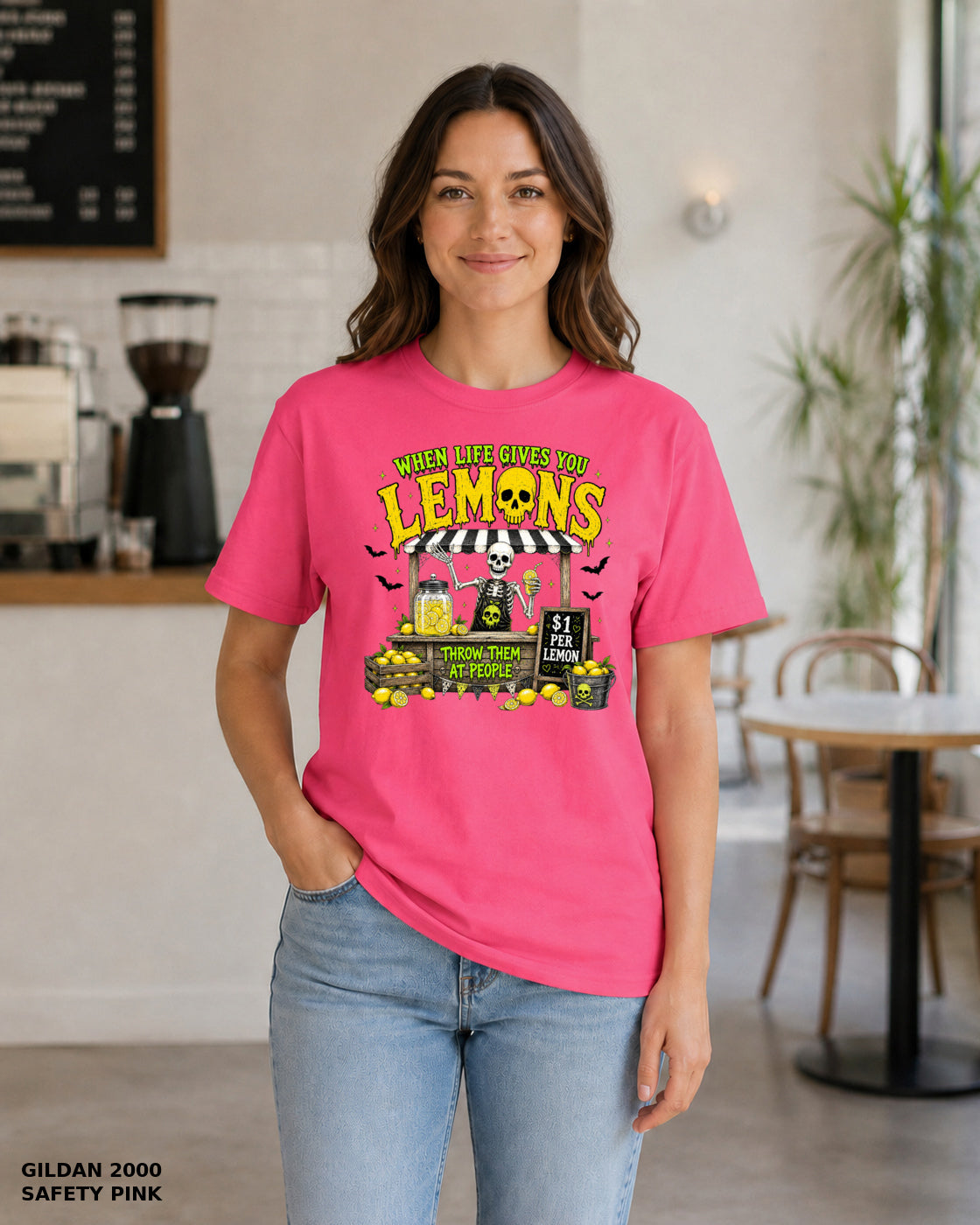 Female model wearing Gildan 2000 Safety Pink When Life Gives You Lemons skeleton Halloween T-shirt, corrected artwork