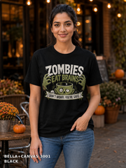 Female model wearing the Bella Canvas 3001 Black Zombies Eat Brains funny Halloween T-shirt