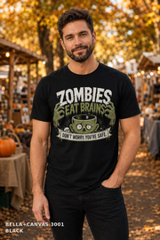 Male model wearing the Bella Canvas 3001 Black Zombies Eat Brains funny Halloween T-shirt