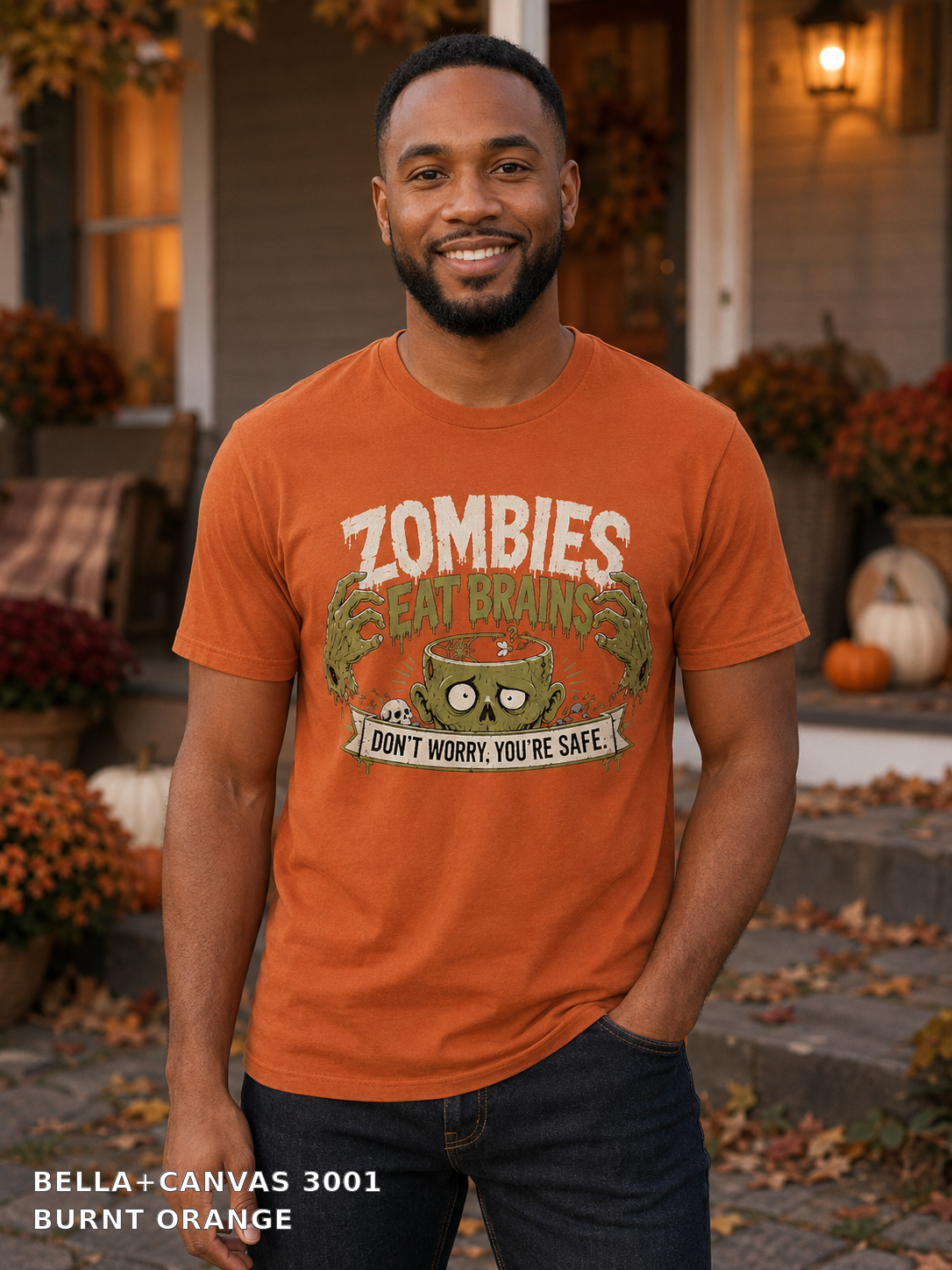 Male model wearing the Bella Canvas 3001 Burnt Orange Zombies Eat Brains funny Halloween T-shirt