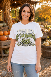 Female model wearing the Bella Canvas 3001 White Zombies Eat Brains funny Halloween T-shirt
