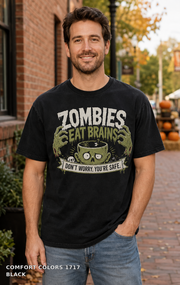 Male model wearing the Comfort Colors 1717 Black Zombies Eat Brains funny Halloween T-shirt