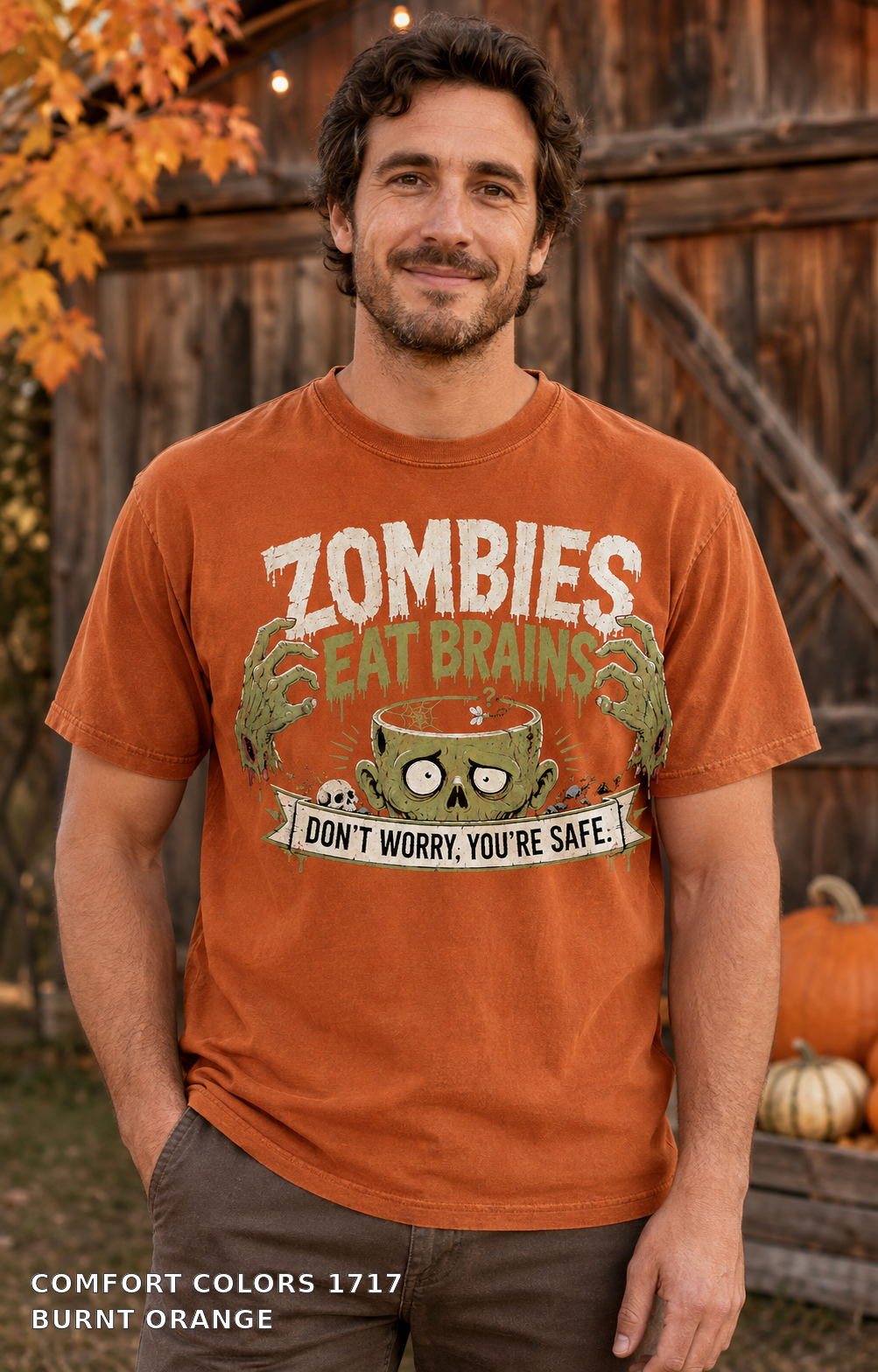 Male model wearing the Comfort Colors 1717 Burnt Orange Zombies Eat Brains funny Halloween T-shirt
