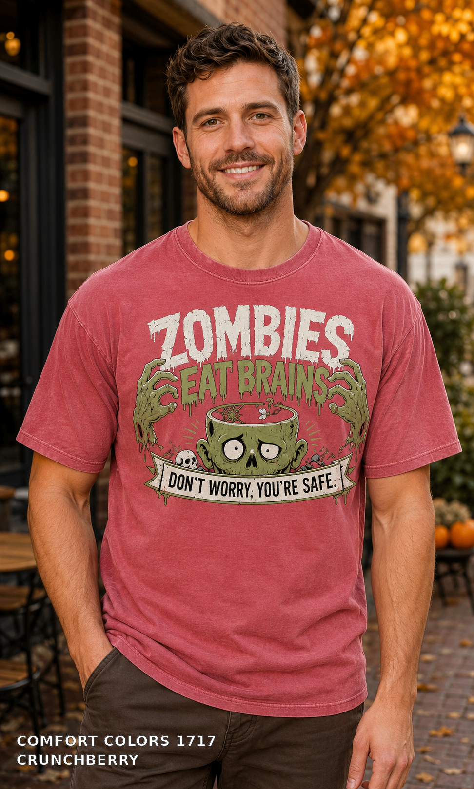 Male model wearing the Comfort Colors 1717 Crunchberry Zombies Eat Brains funny Halloween T-shirt