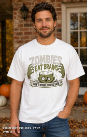 Male model wearing the Comfort Colors 1717 White Zombies Eat Brains funny Halloween T-shirt