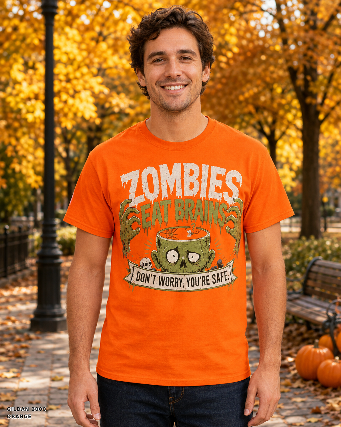 Male model wearing the Gildan 2000 Orange Zombies Eat Brains funny Halloween T-shirt